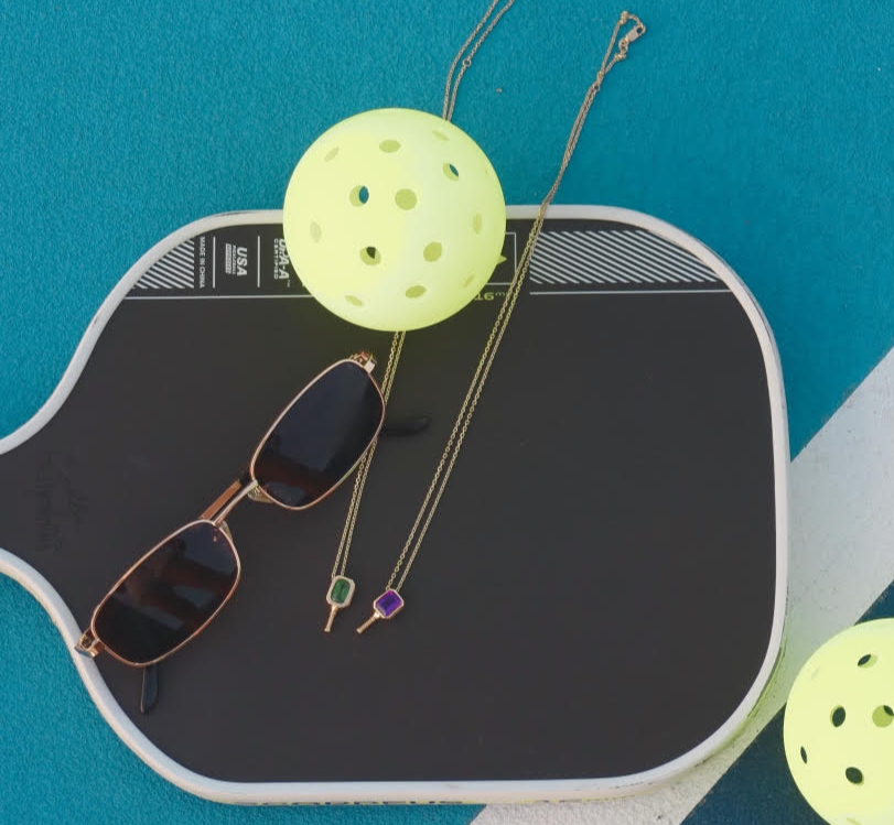 Necklaces on Pickleball Paddle