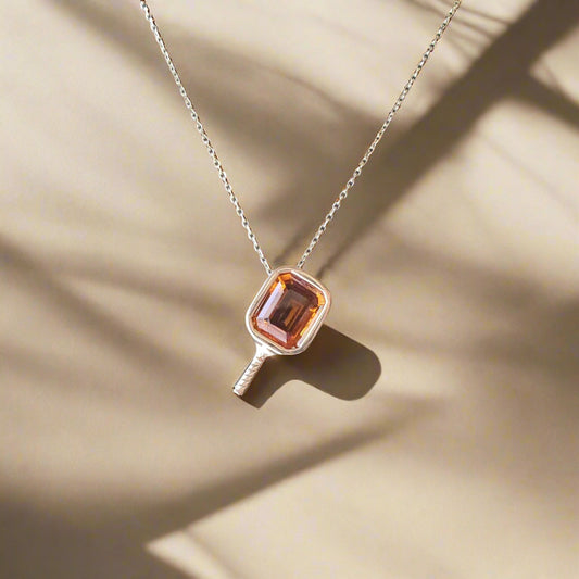 Necklace with citrine bezel set in pickleball setting on chain